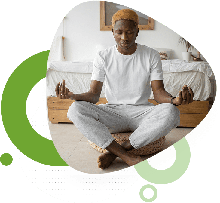 A man sitting in the middle of his yoga practice.