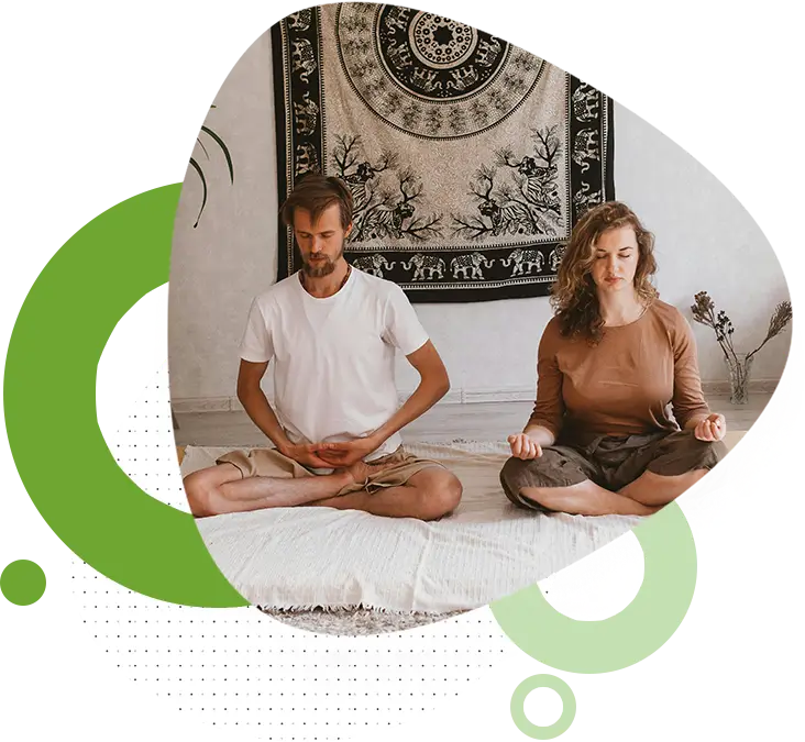 ab1 Couple practicing meditation at home together.